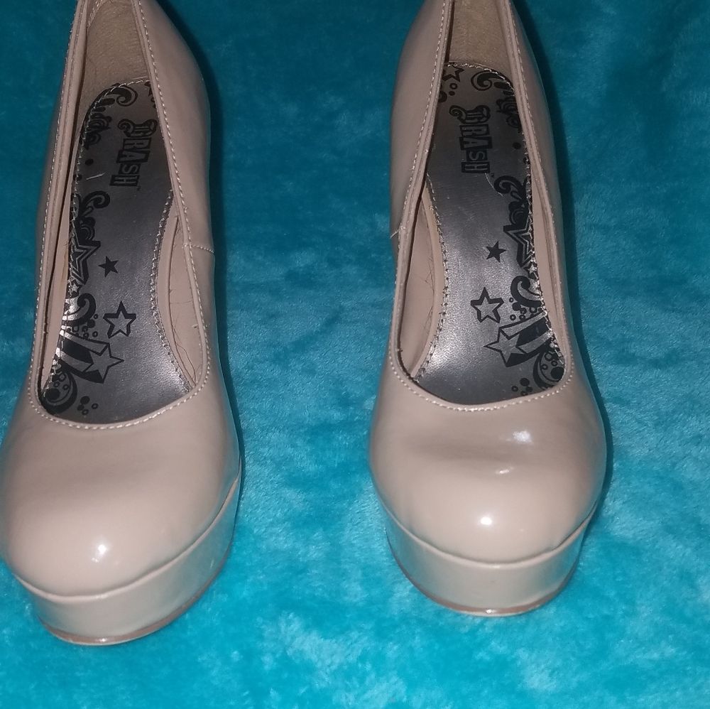 High heel pumps by trash